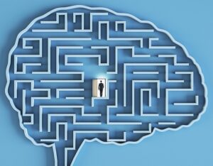 Man walking through door inside a brain maze